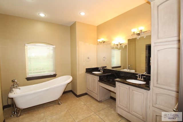 27281 Palm Blvd, Harlingen, TX 78552 - bathroom with a freestanding tub, double vanity, tile patterned flooring, and recessed lighting