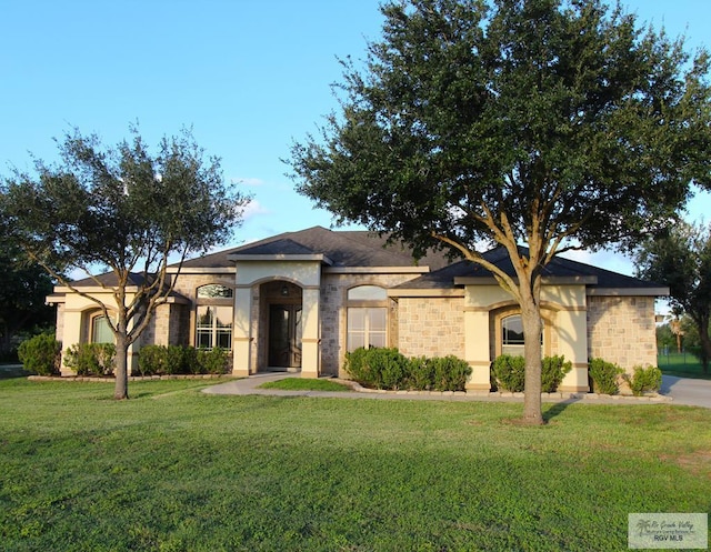27281 Palm Blvd, Harlingen, TX 78552 - view of front of home with a front yard and stucco siding