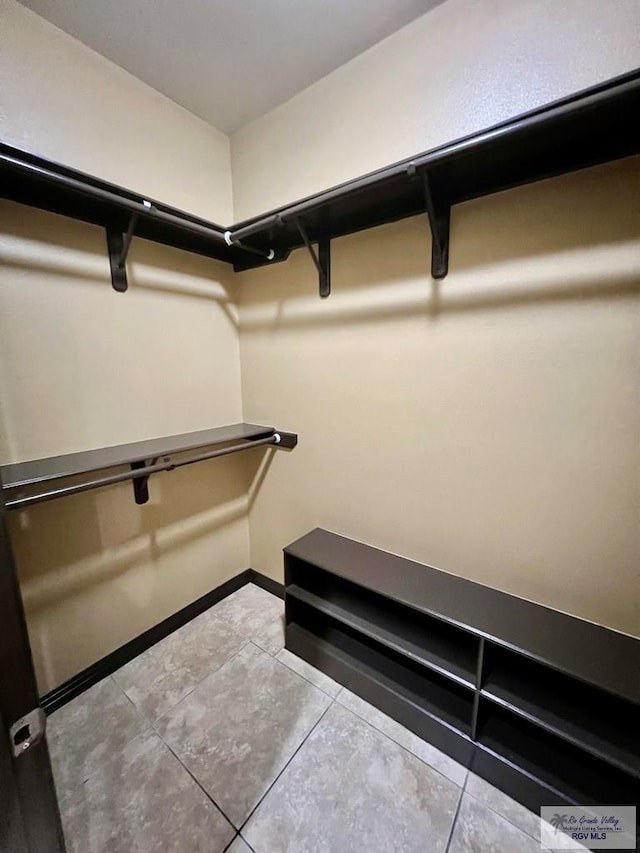 27281 Palm Blvd, Harlingen, TX 78552 - walk in closet featuring light tile patterned floors