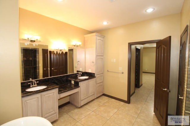 27281 Palm Blvd, Harlingen, TX 78552 - bathroom featuring double vanity, tile patterned flooring, and recessed lighting