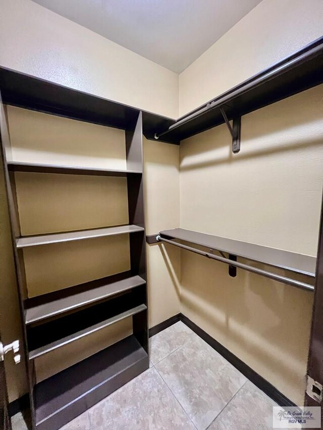 27281 Palm Blvd, Harlingen, TX 78552 - walk in closet with light tile patterned floors