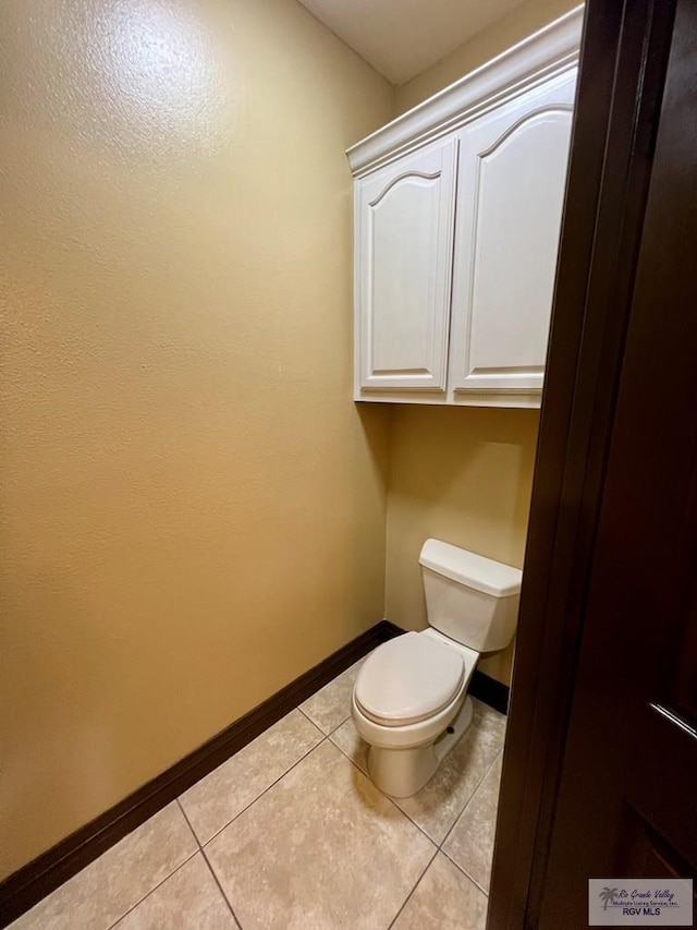 27281 Palm Blvd, Harlingen, TX 78552 - bathroom with baseboards and tile patterned floors