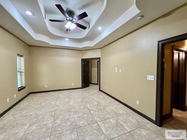 27281 Palm Blvd, Harlingen, TX 78552 - unfurnished room with a tray ceiling, a ceiling fan, a smoke detector, light tile patterned floors, and recessed lighting