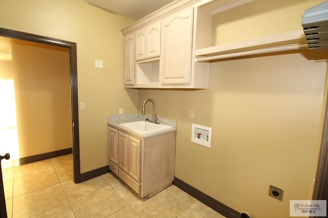 27281 Palm Blvd, Harlingen, TX 78552 - laundry room featuring hookup for an electric dryer, light tile patterned flooring, cabinet space, and washer hookup