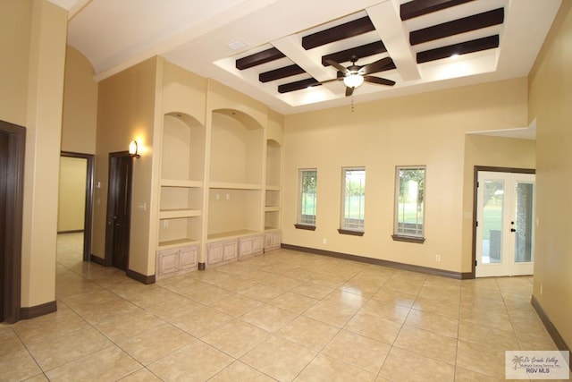 27281 Palm Blvd, Harlingen, TX 78552 - spare room with light tile patterned flooring, built in features, coffered ceiling, a towering ceiling, and a ceiling fan