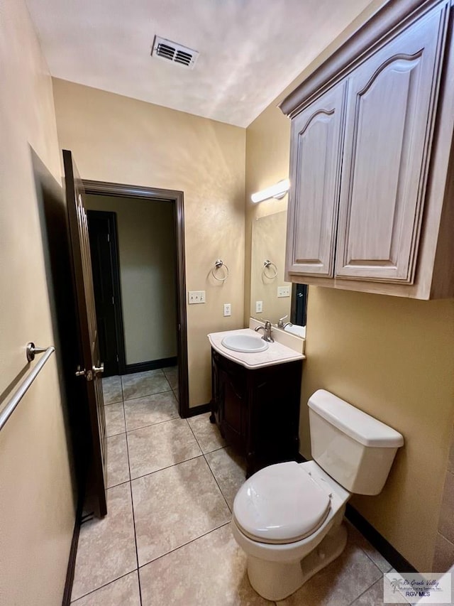27281 Palm Blvd, Harlingen, TX 78552 - half bathroom with vanity and tile patterned floors