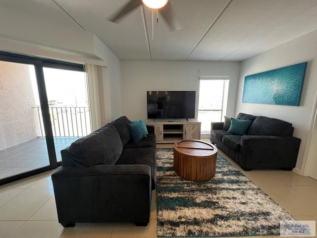 109 W Tarpon St Unit 301, South Padre Island, TX 78597 - living area with light tile patterned floors and ceiling fan