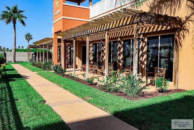 exterior space with a patio area and a pergola