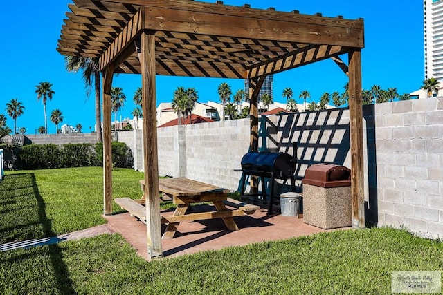 view of patio featuring a grill and a pergola