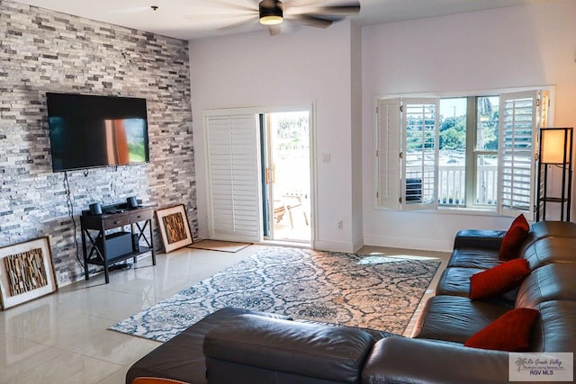 tiled living room featuring ceiling fan