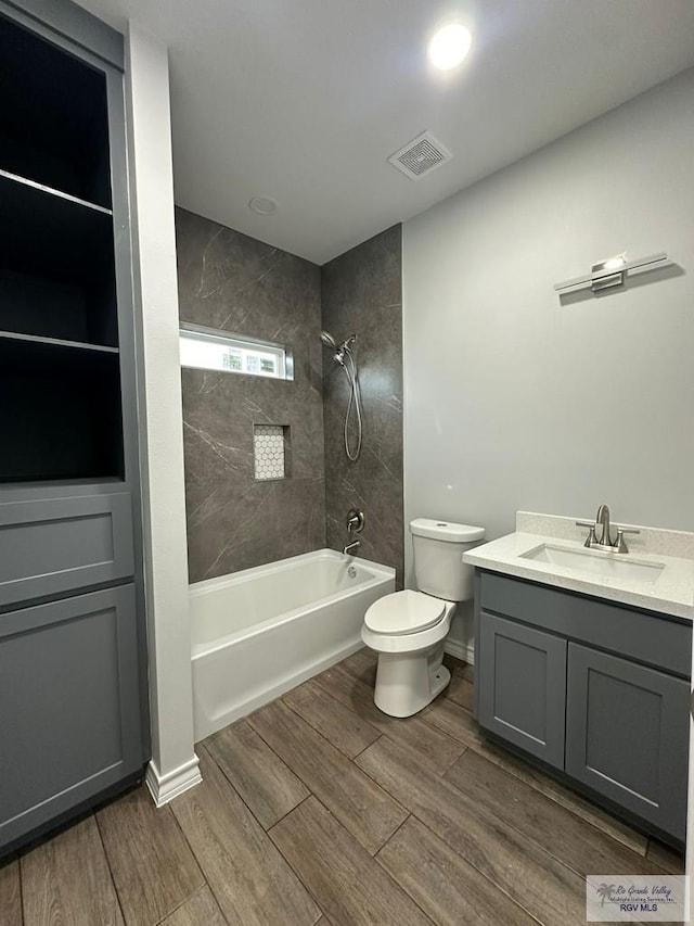 2299 Athens St, Brownsville, TX 78520 - bathroom with  shower combination, vanity, and wood finished floors