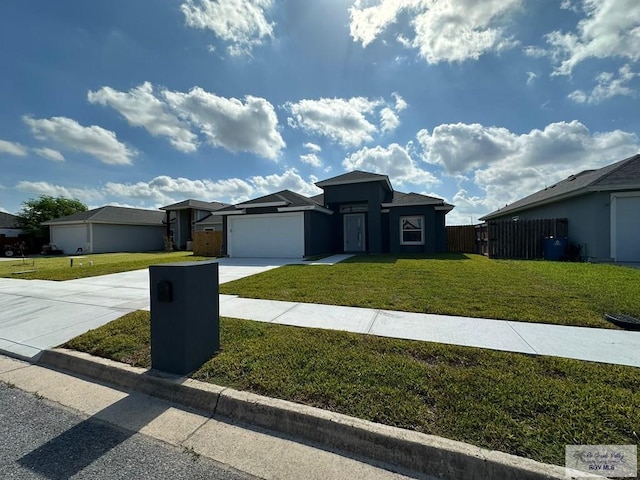 2299 Athens St, Brownsville, TX 78520 - prairie-style home featuring a garage, driveway, and stucco siding
