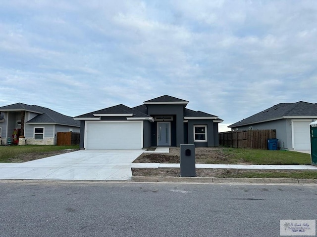 prairie-style home featuring a garage