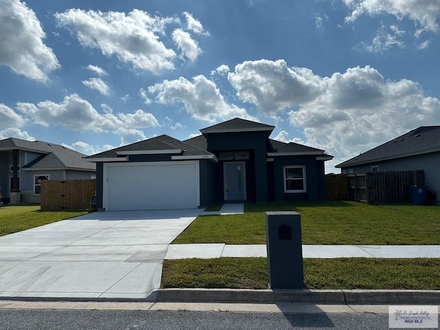 2299 Athens St, Brownsville, TX 78520 - prairie-style home featuring a garage, driveway, and stucco siding