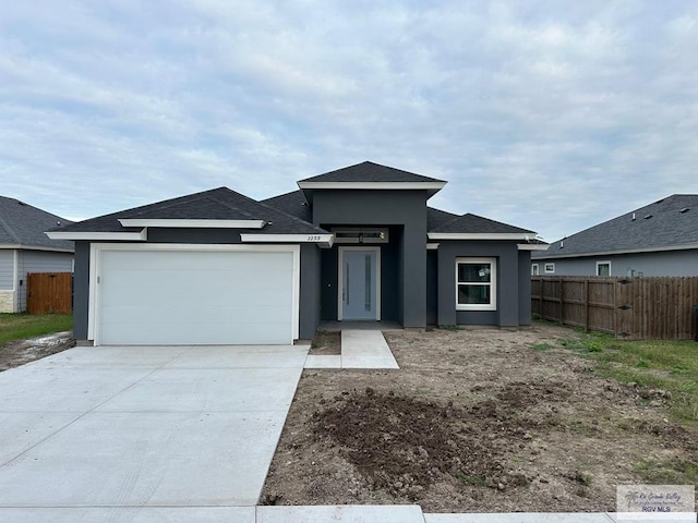 prairie-style home featuring a garage