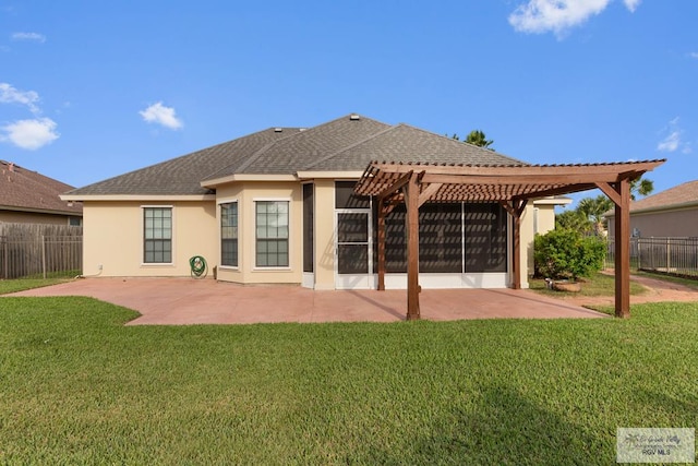 rear view of property with a patio area, a pergola, and a yard