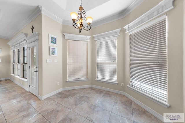 unfurnished dining area with an inviting chandelier and ornamental molding