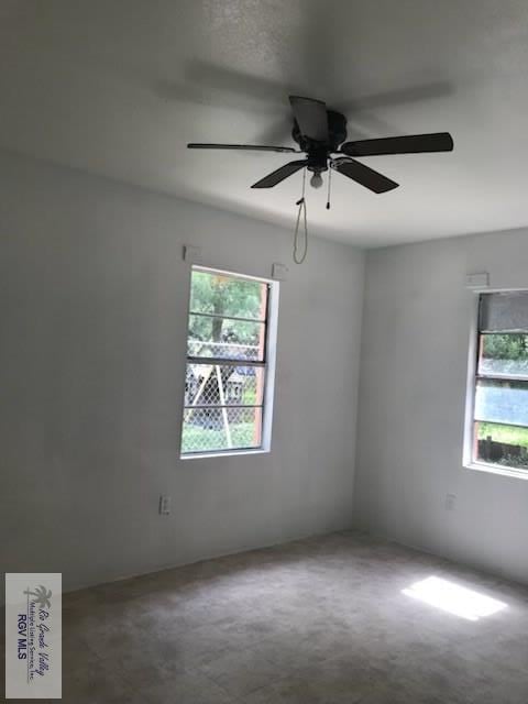 spare room with ceiling fan