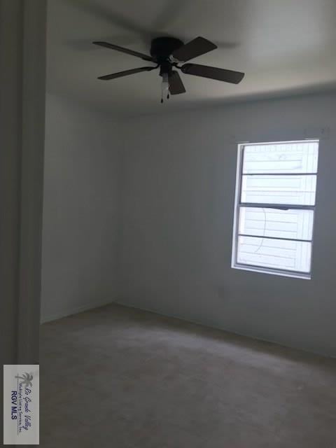 spare room with a ceiling fan