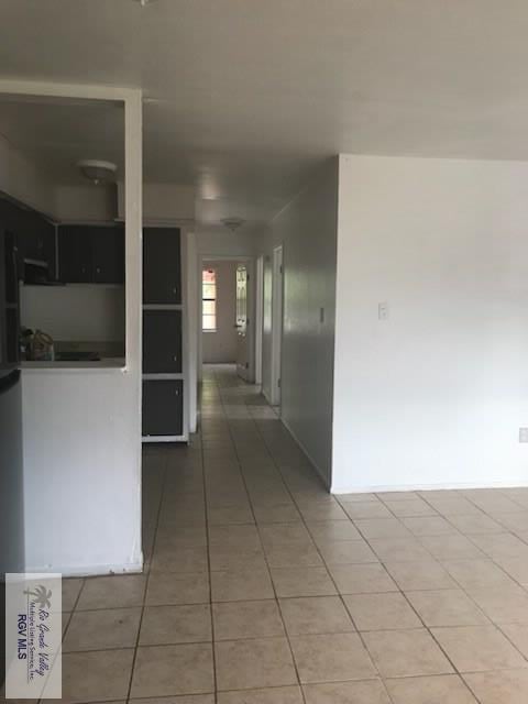 hallway featuring tile patterned floors