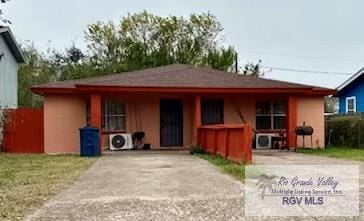 view of front of property with ac unit