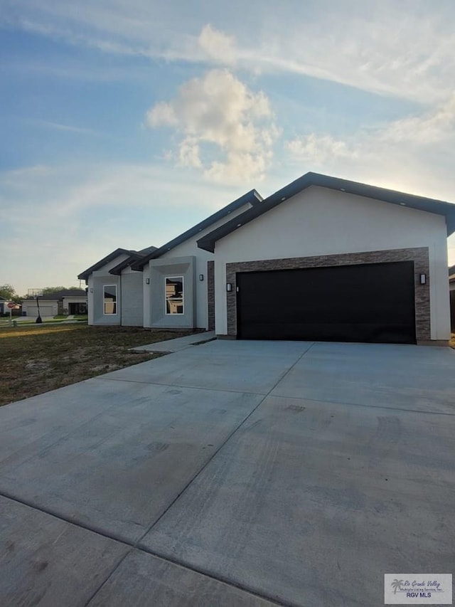 ranch-style home with a garage