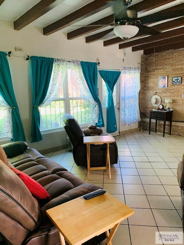 living room with beam ceiling, ceiling fan, and light tile patterned floors