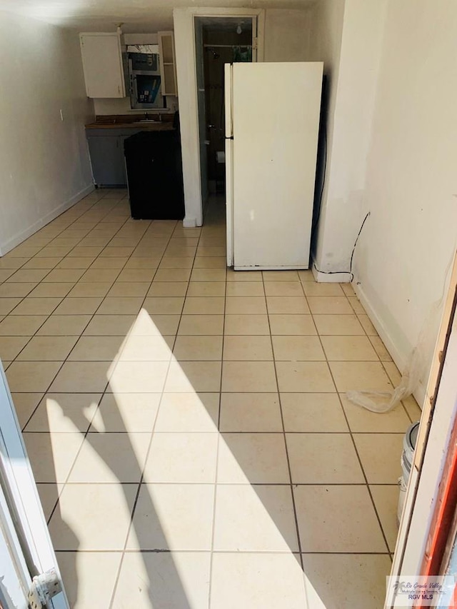 tiled spare room with sink