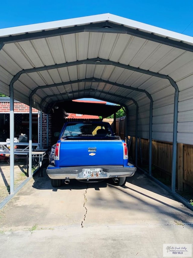 view of vehicle parking with a carport