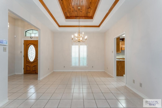 entryway with a chandelier, a tray ceiling, light tile patterned floors, wood ceiling, and ornamental molding