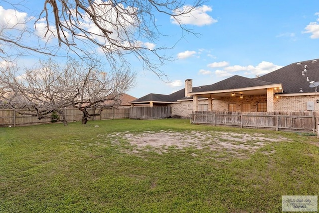 view of yard with ceiling fan