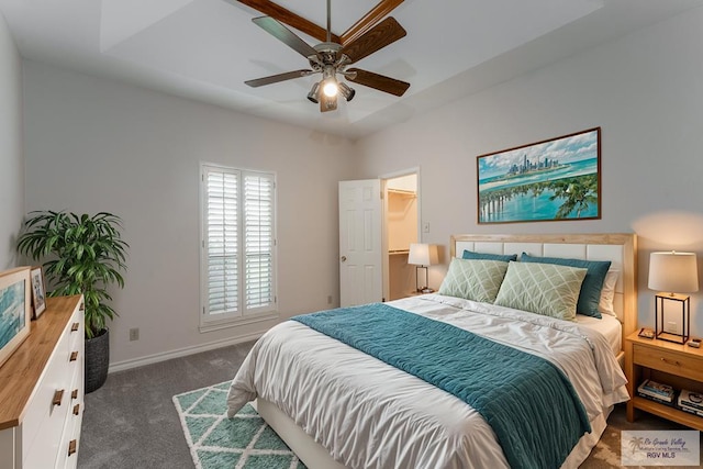 bedroom featuring dark carpet and ceiling fan