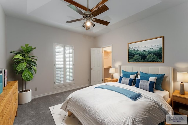 bedroom featuring ceiling fan and dark colored carpet