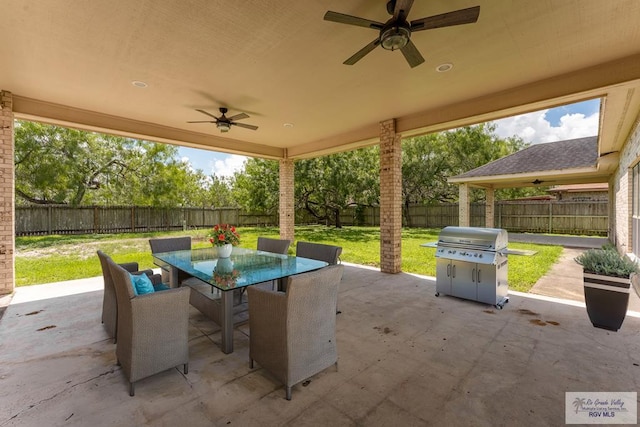 view of patio with ceiling fan and area for grilling