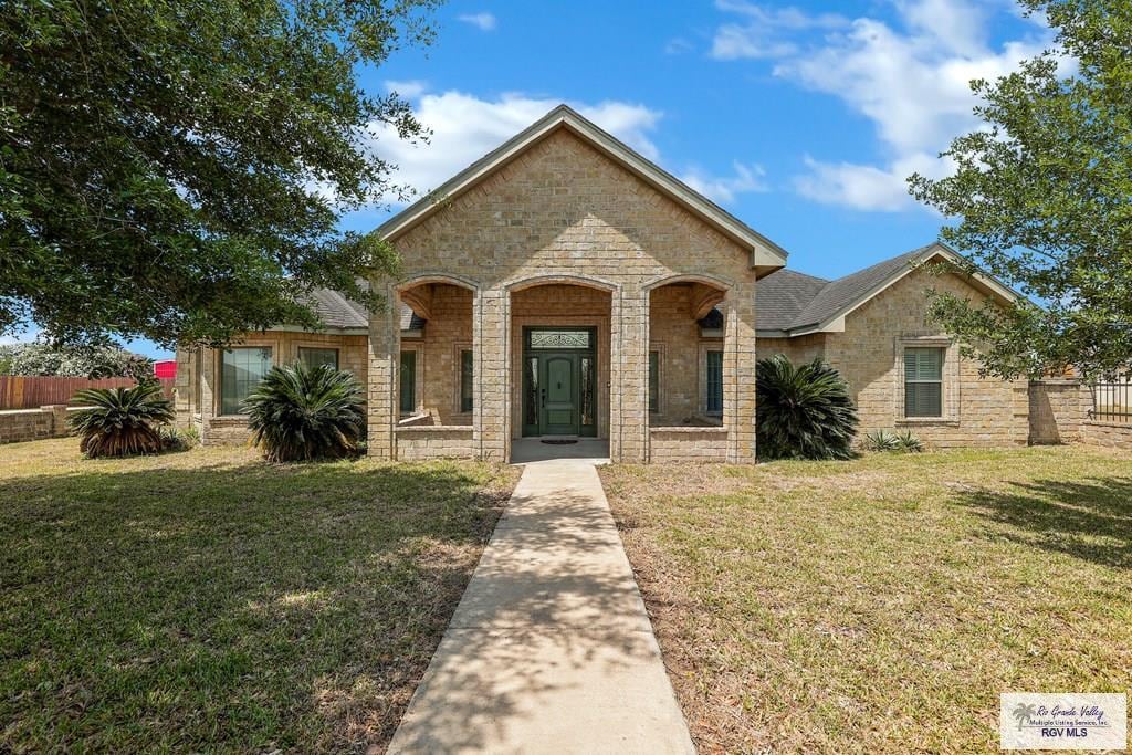23814 Richmond Dr, Harlingen, TX 78552 - view of front of property with stone siding