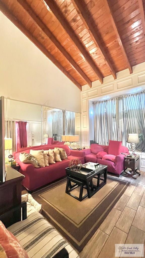 living area featuring wood ceiling, wood tiled floor, beamed ceiling, and high vaulted ceiling