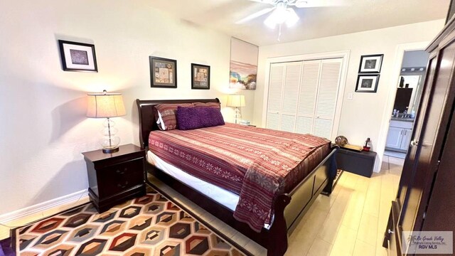 bedroom featuring light wood finished floors, a ceiling fan, baseboards, and a closet
