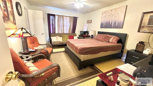 bedroom featuring wood finished floors and a ceiling fan