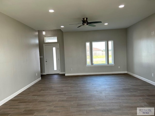 interior space with recessed lighting, baseboards, dark wood-type flooring, and a ceiling fan