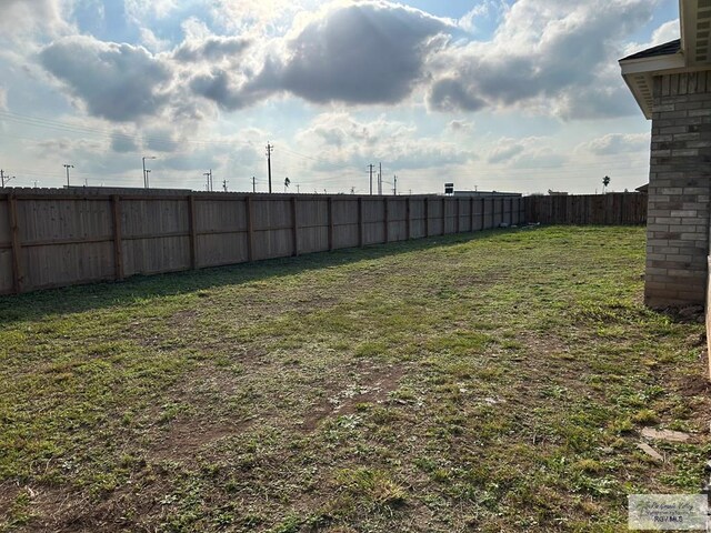 view of yard with a fenced backyard