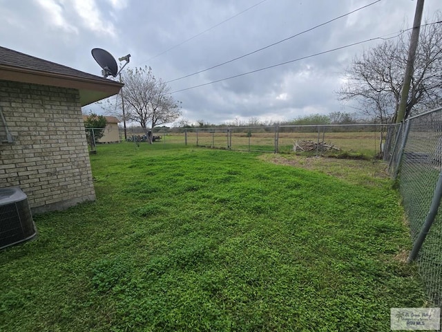 view of yard with central AC