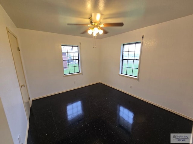 spare room with ceiling fan