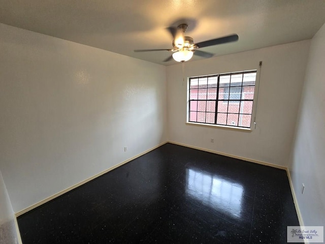 spare room with ceiling fan