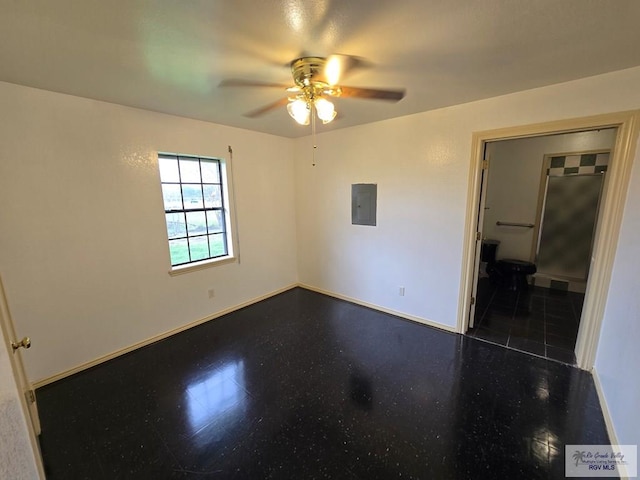 unfurnished room featuring electric panel and ceiling fan