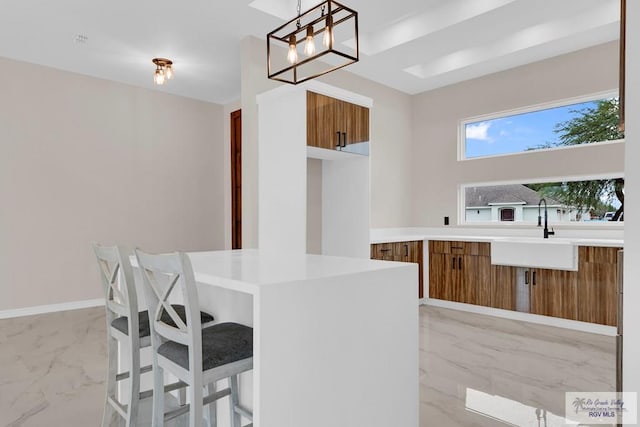 kitchen with sink and hanging light fixtures