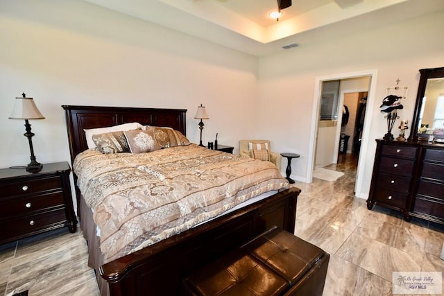 bedroom featuring a tray ceiling