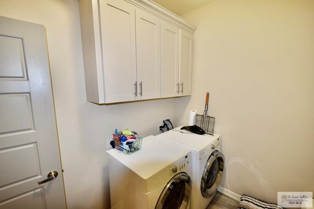 laundry room with cabinets and independent washer and dryer