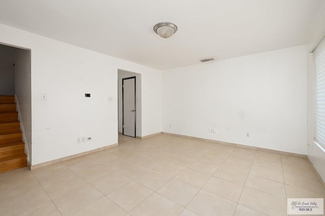 unfurnished room featuring plenty of natural light