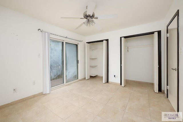 unfurnished bedroom with ceiling fan, light tile patterned floors, access to outside, and multiple closets