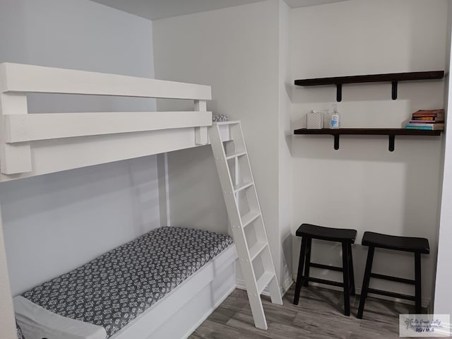 bedroom featuring dark wood-type flooring